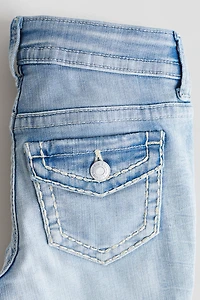 Jean près du corps semi-évasé taille basse