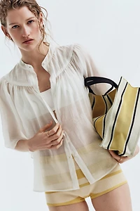 Blouse à manches papillon