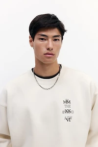 Chandail ample en molleton imprimé