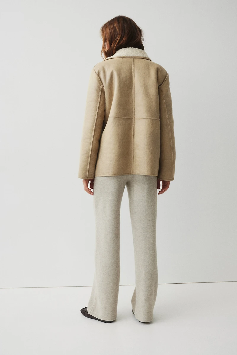 Pantalon en maille côtelée avec plis