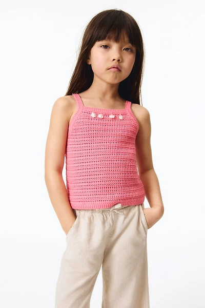 Haut ornementé en tricot