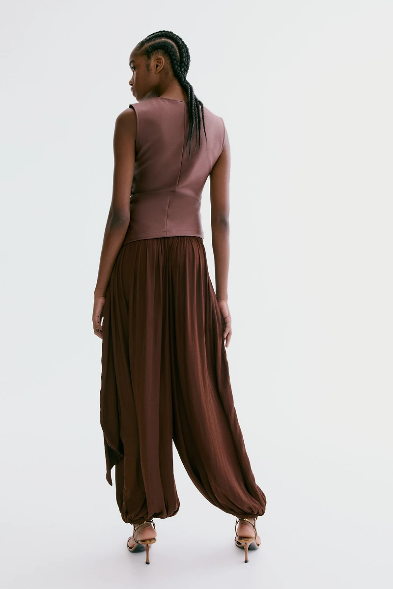 Pantalon à jambes ballon avec panneau drapé