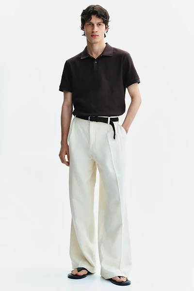 Polo près du corps en tricot gaufré