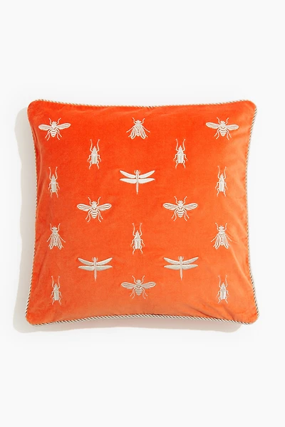 Housse de coussin brodée