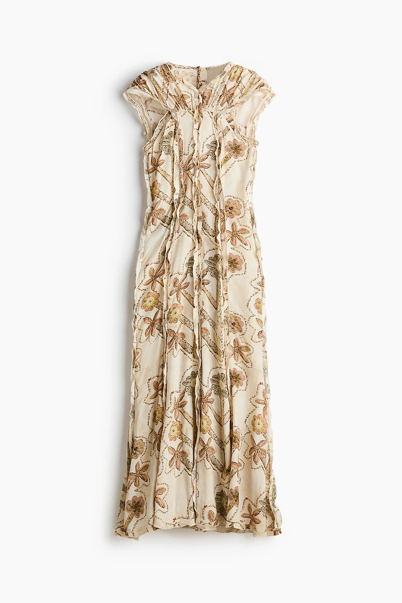 Robe plissée à imprimé fleuri et dos ouvert