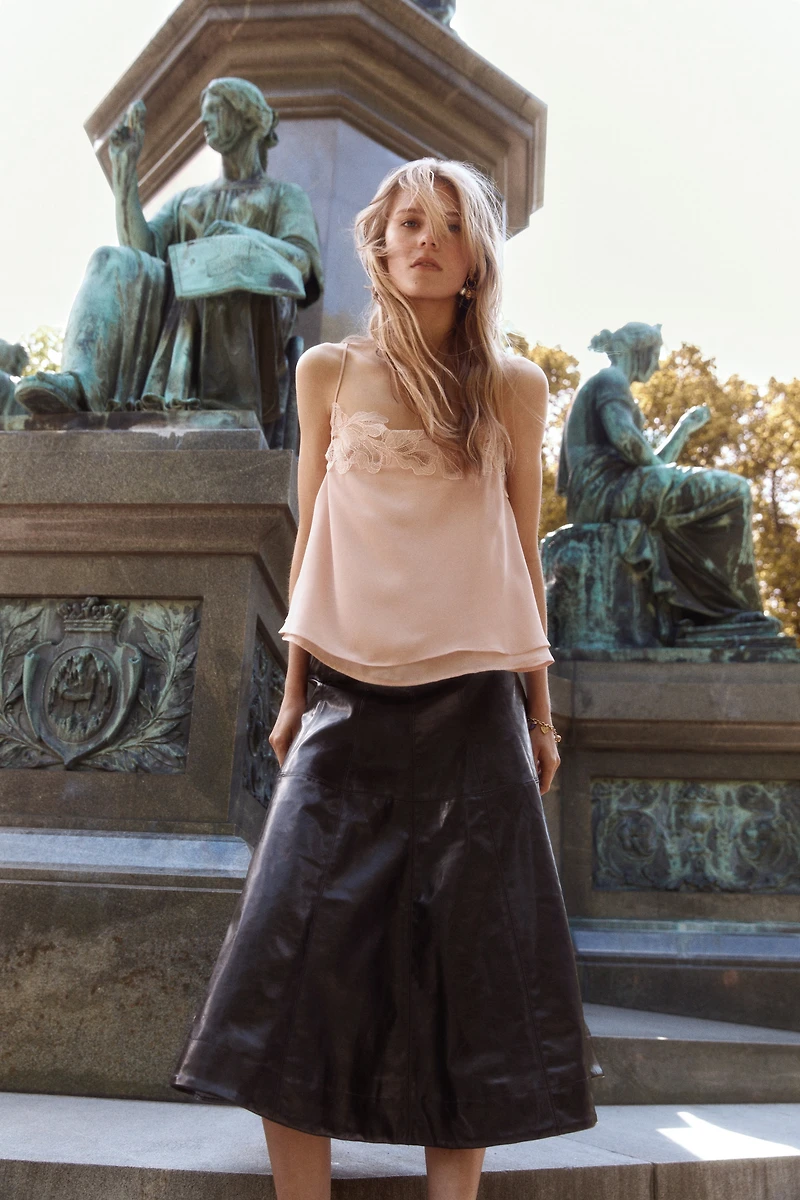 Jupe corolle en tissu enduit