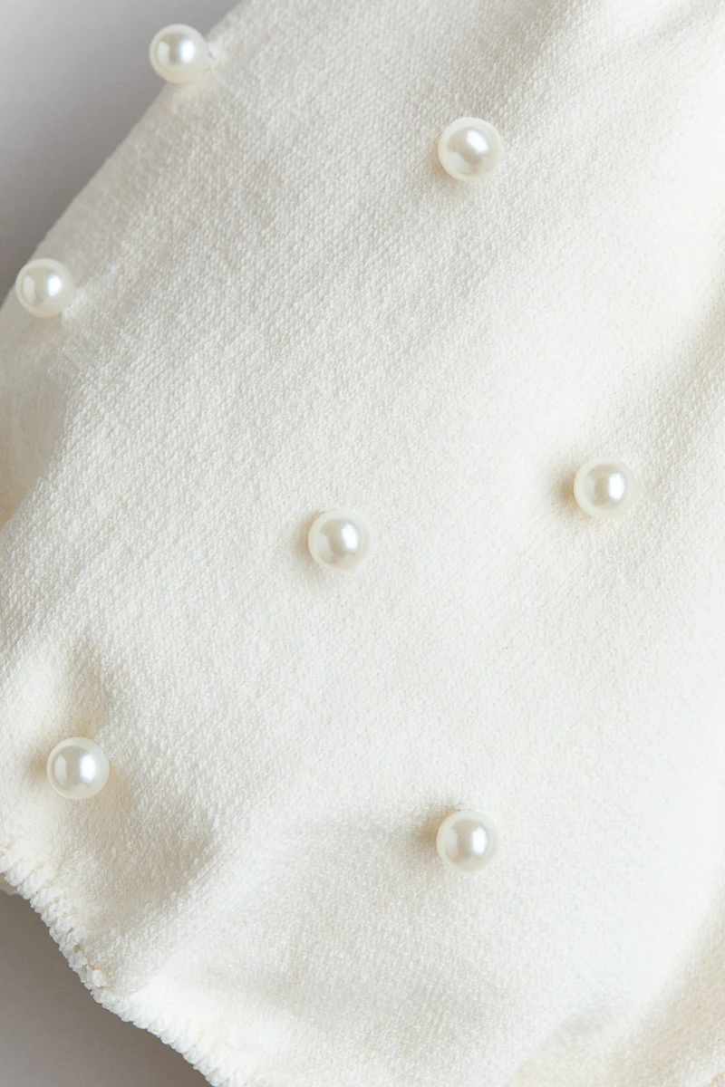 Haut en fin tricot avec perles de fantaisie
