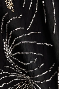 Robe ornée à dos dénudé