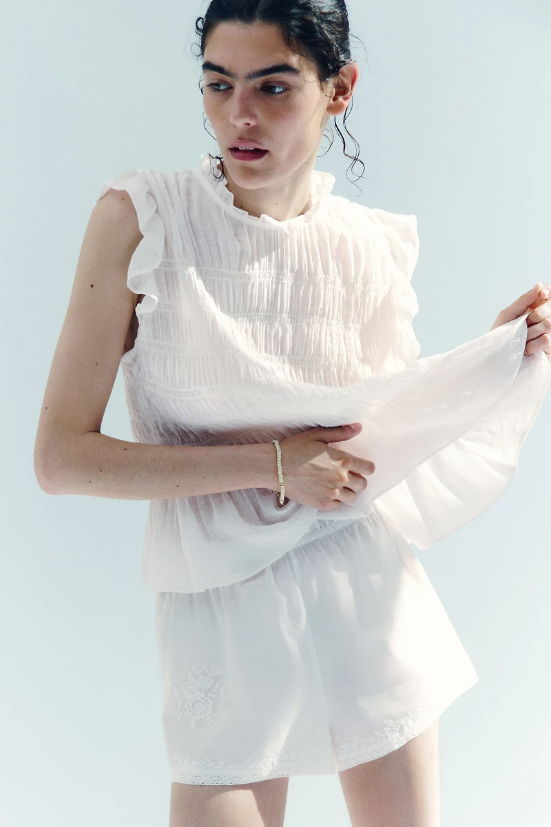 Haut péplum smocké