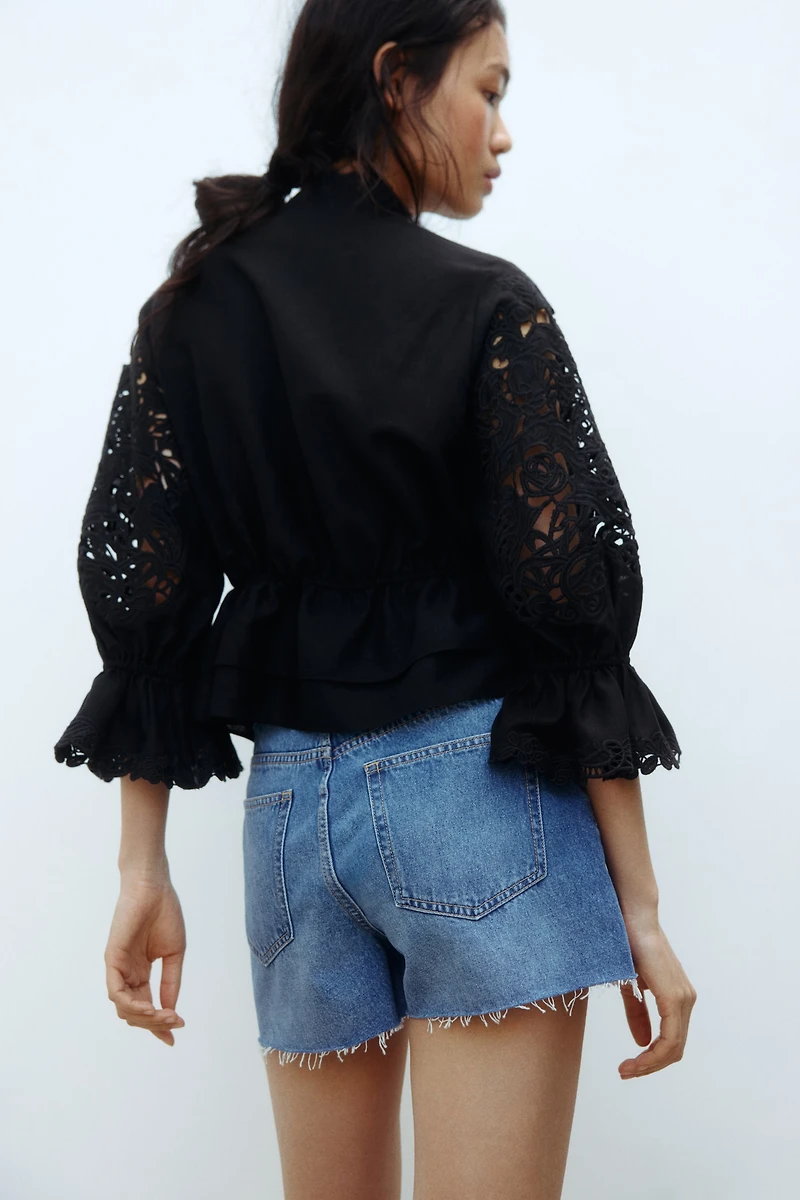 Raw-edge denim shorts