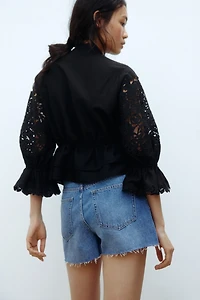 Raw-edge denim shorts