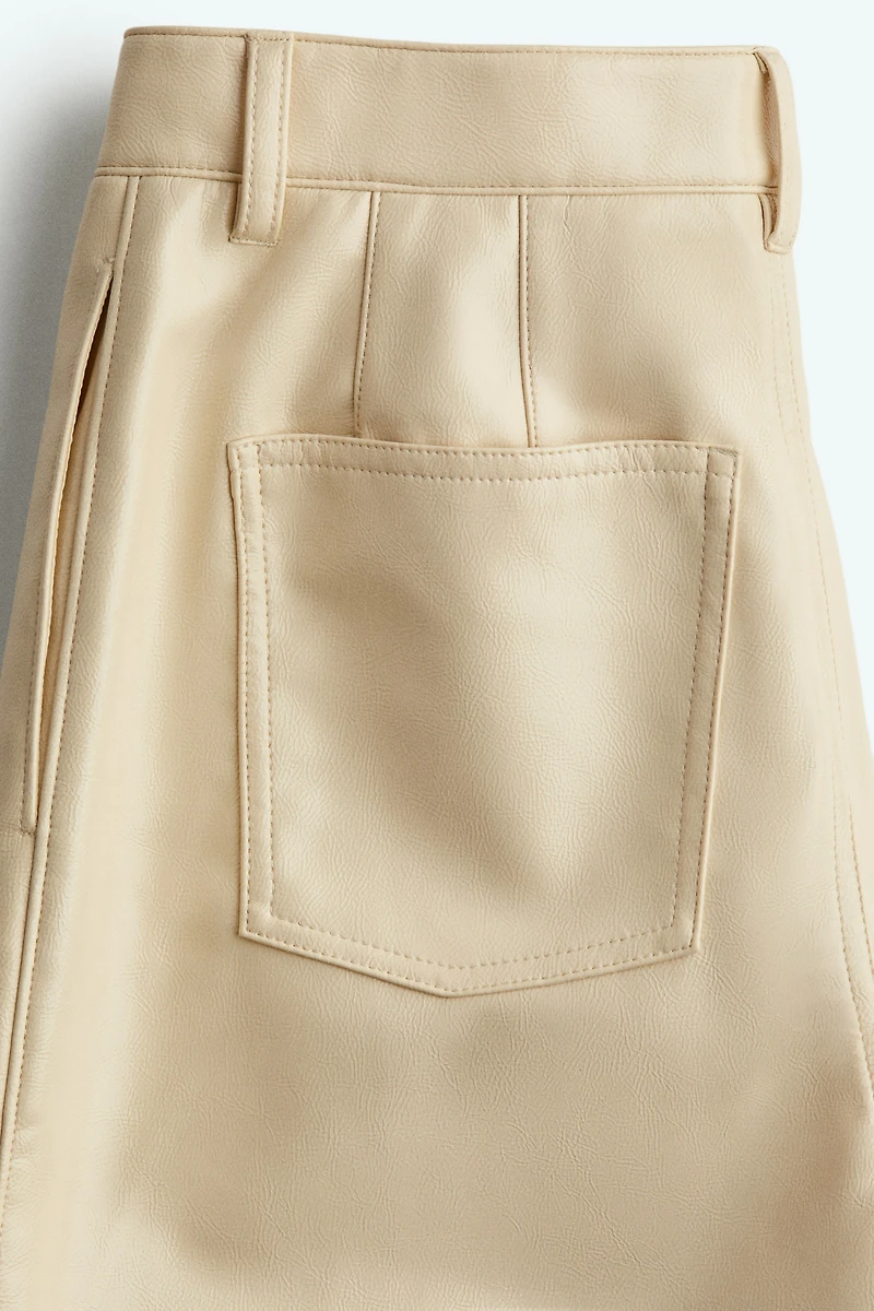Pantalon en tissu enduit