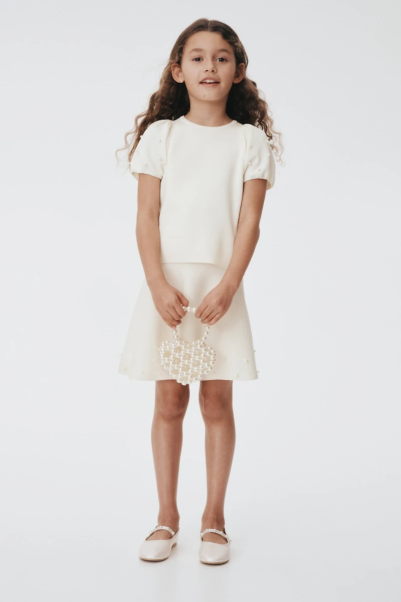 Haut en fin tricot avec perles de fantaisie