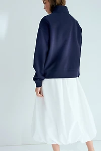 Chandail col à fermeture éclair et motifs