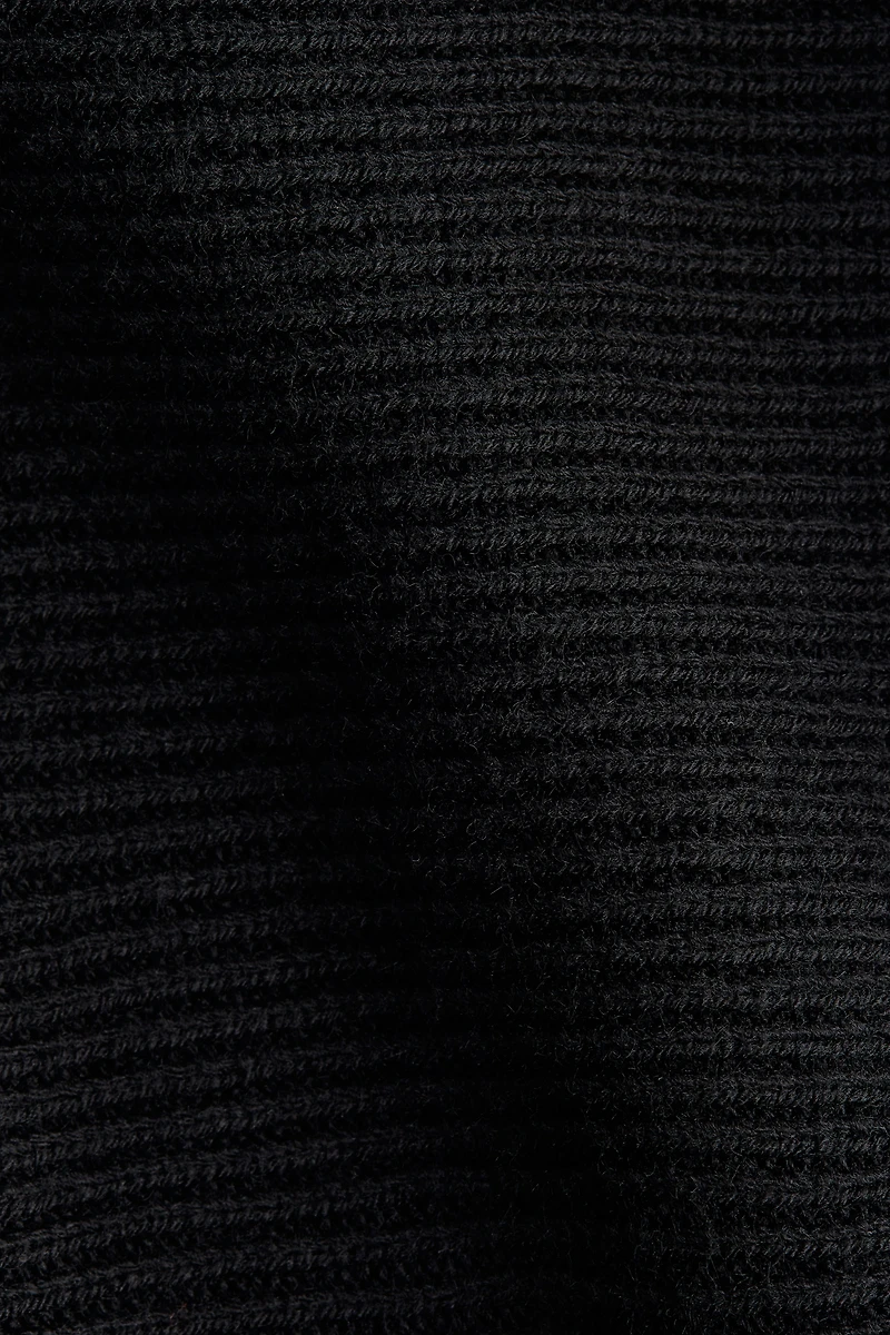 Cape en tricot côtelé