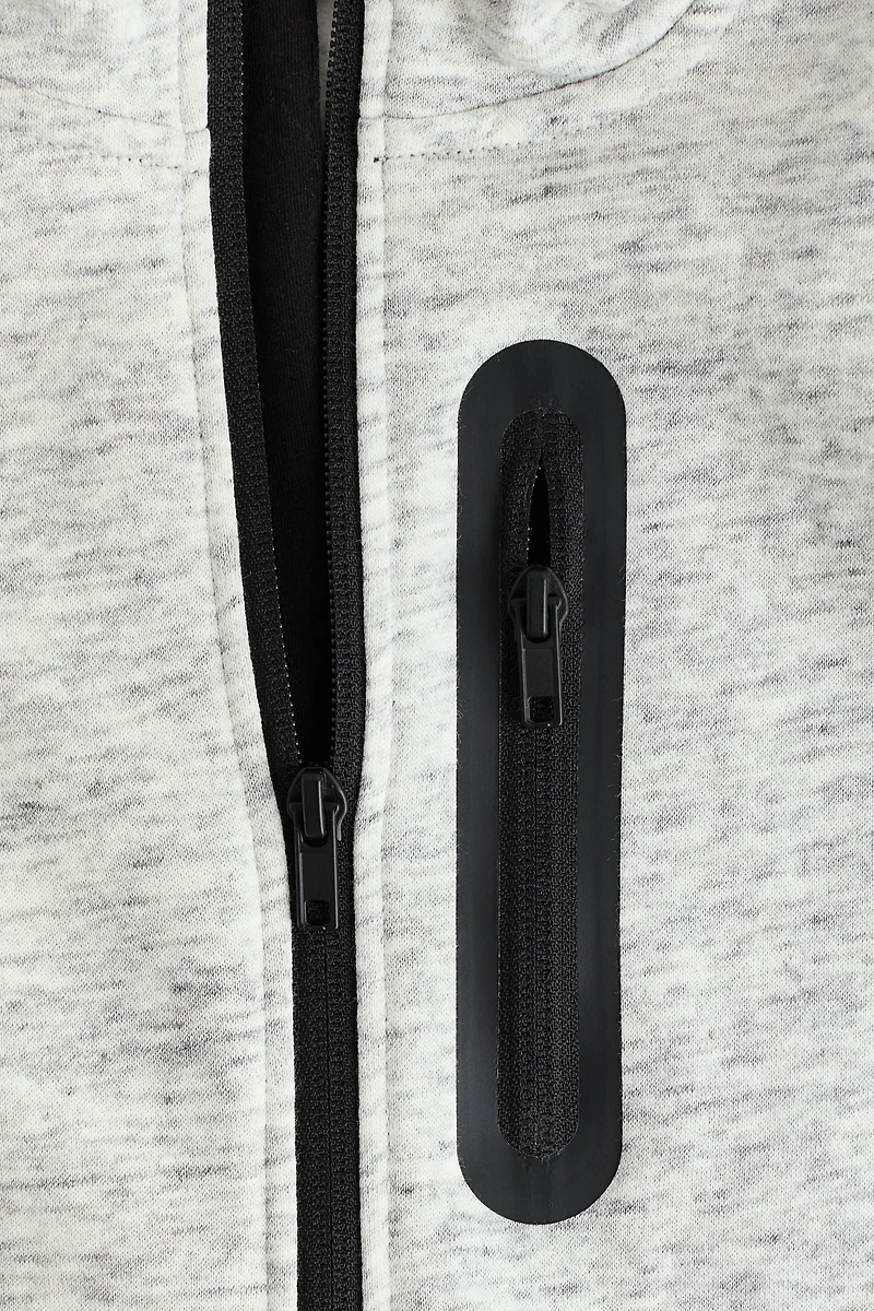 Veste à capuche et fermeture éclair