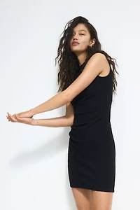Robe moulante à effet drapé