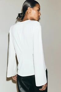 Haut avec détail torsadé