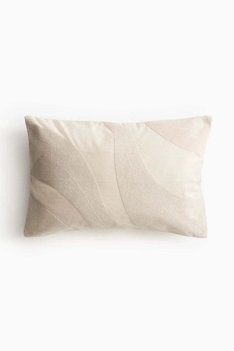 Housse de coussin brodée