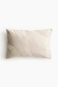 Housse de coussin brodée