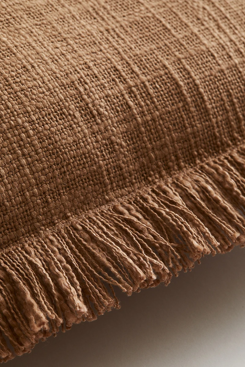 Housse de coussin en tissu flammé