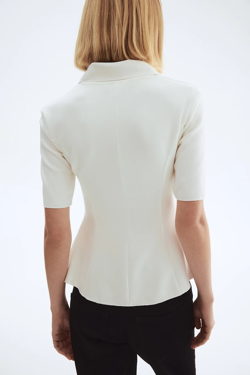 Haut en interlock avec col