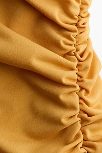 Robe dos nu à effet drapé