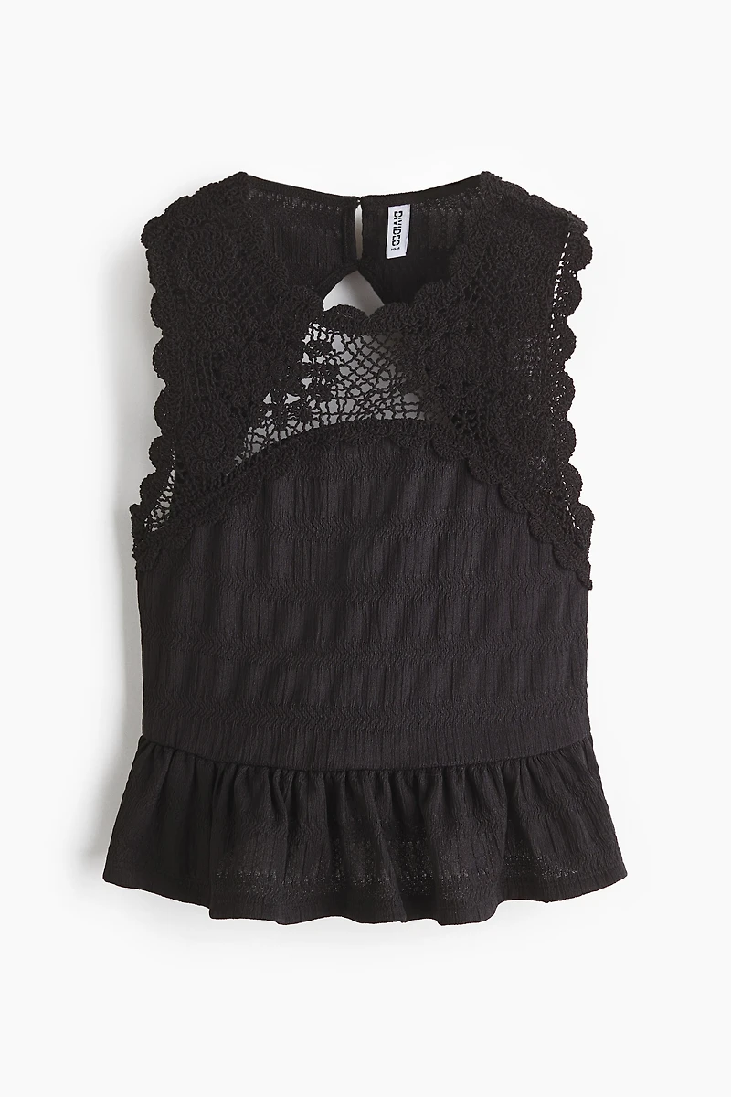 Haut texturé avec partie d’aspect crochet