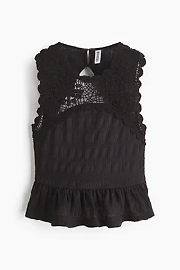Haut texturé avec partie d’aspect crochet