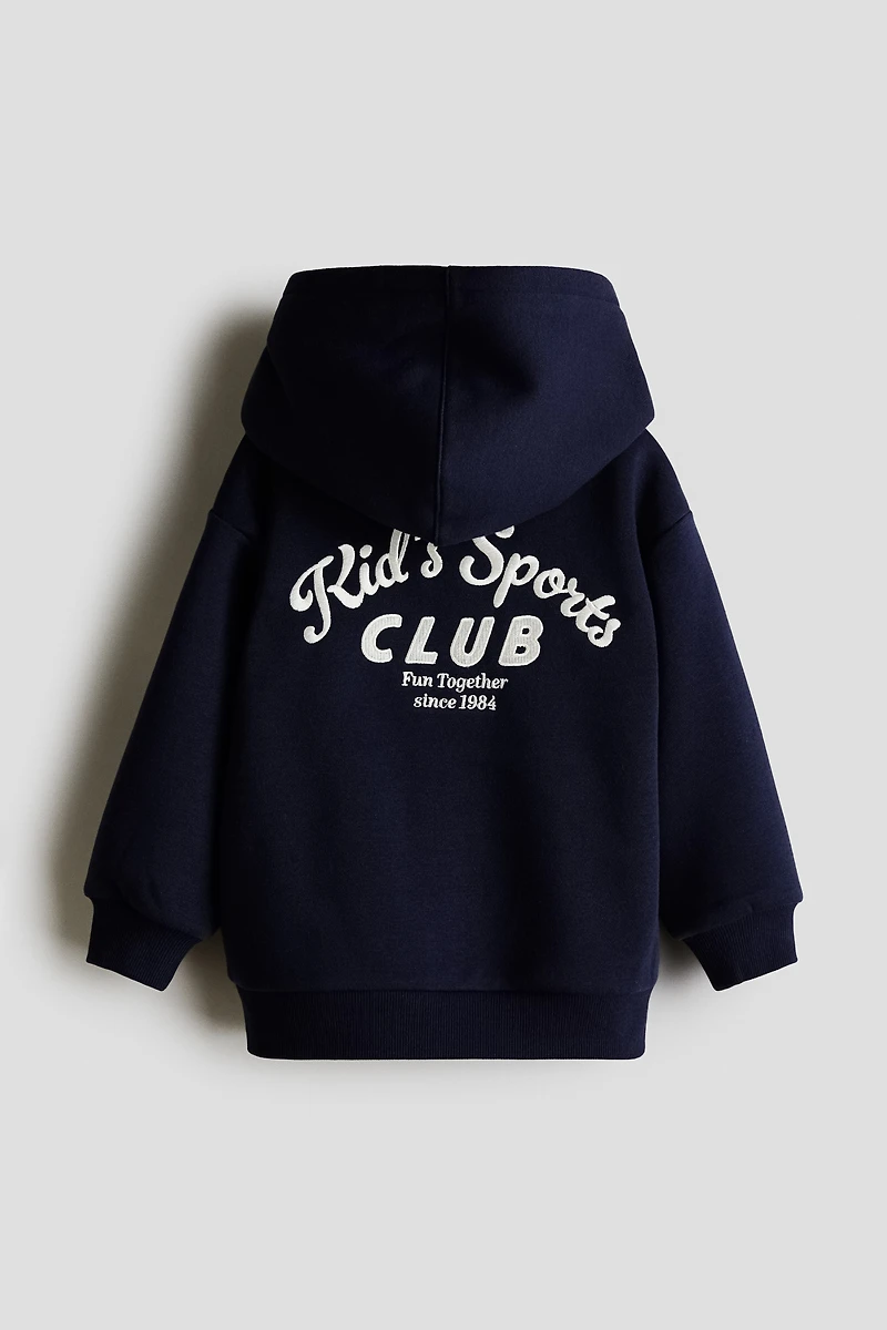 Veste à capuche fermeture éclair détails brodés