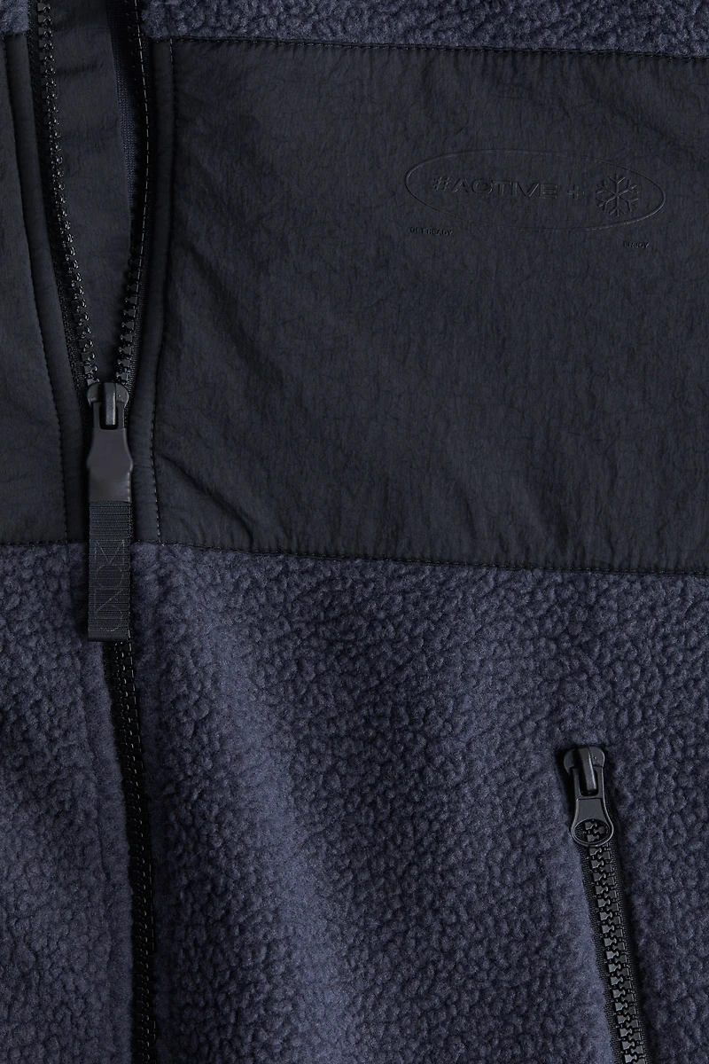 Veste de sport à fermeture éclair avec capuchon