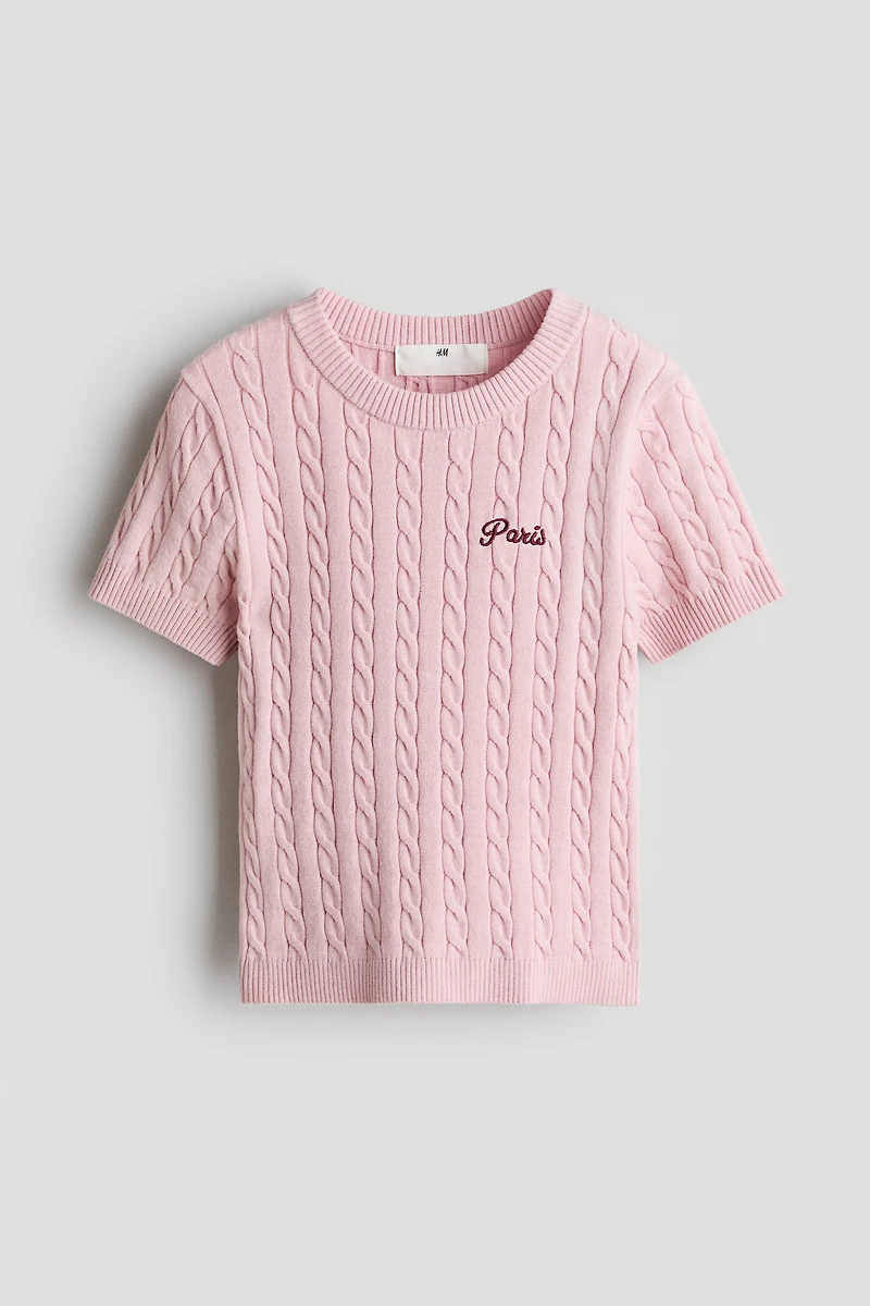 Haut en tricot torsadé