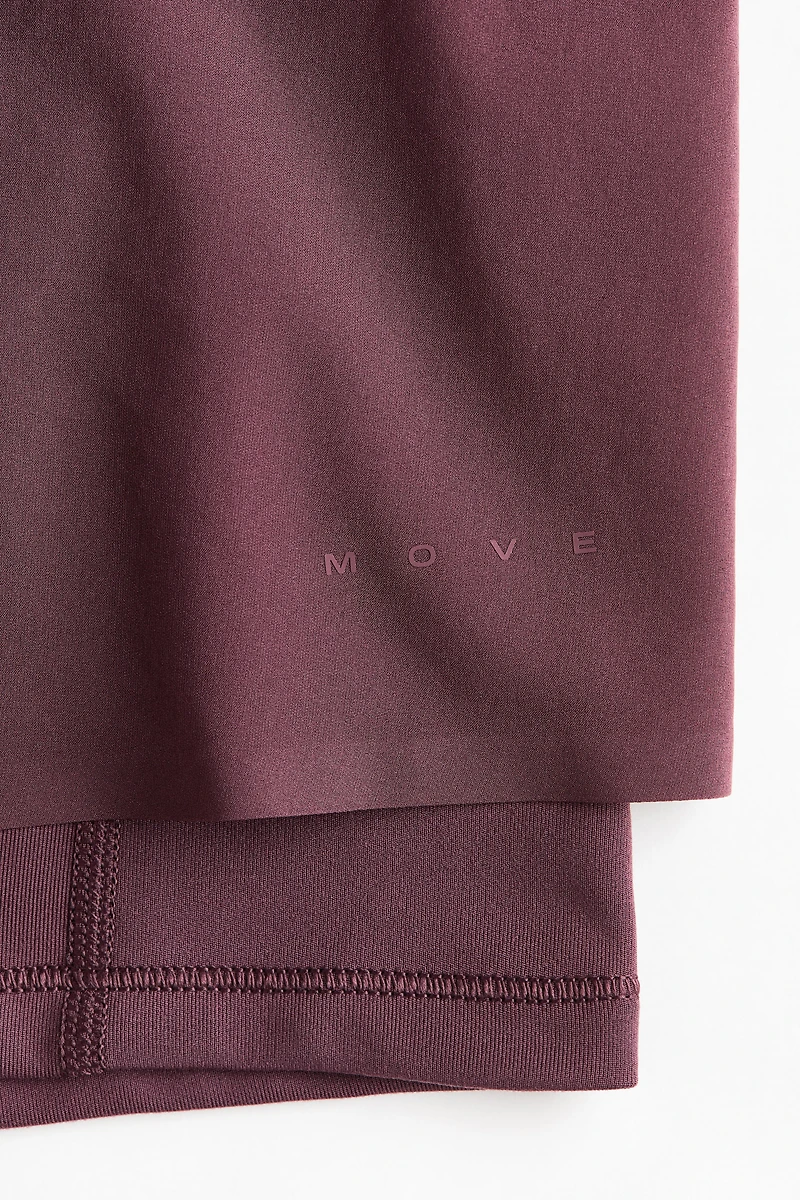 Short de sport superposé avec poche