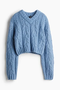 Chandail en tricot torsadé avec encolure V