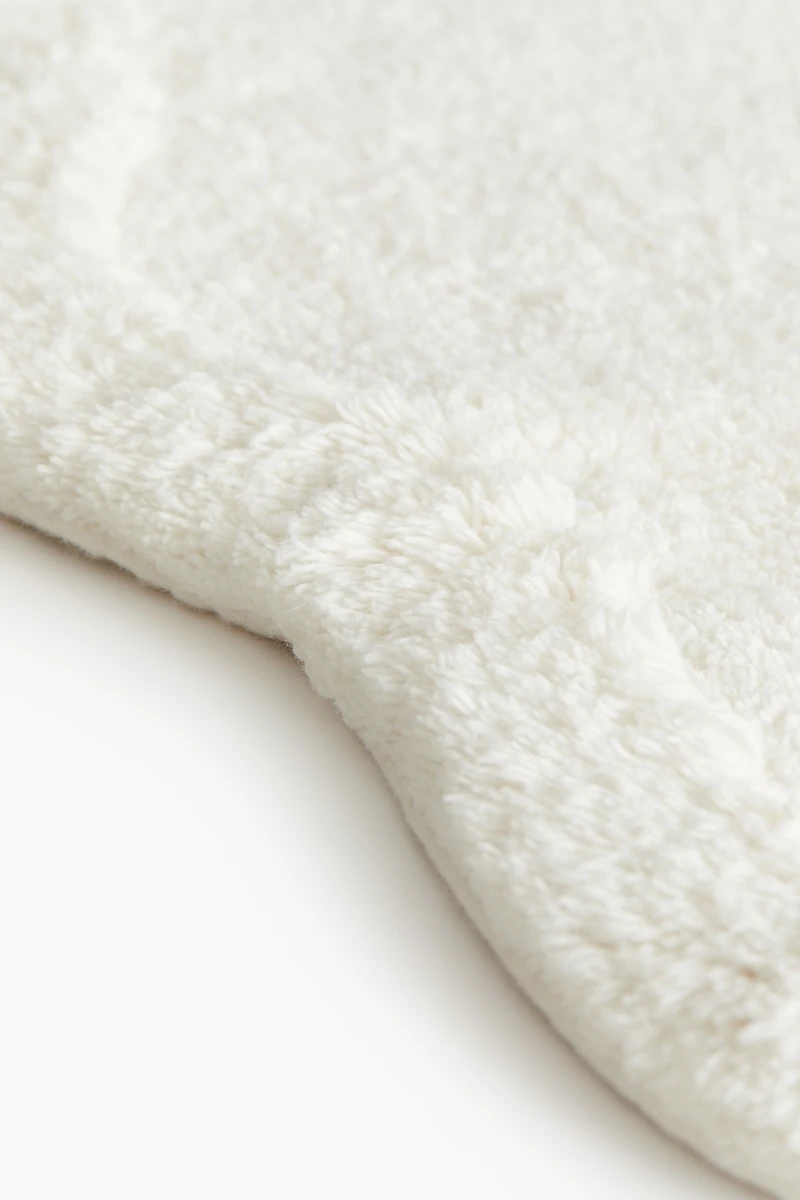 Tapis de bain en coton touffeté