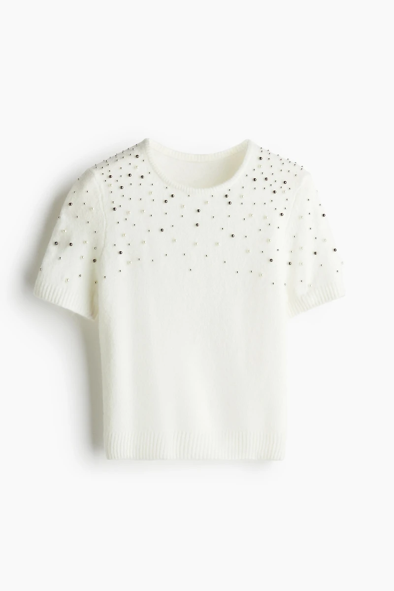 Haut ornementé en fin tricot