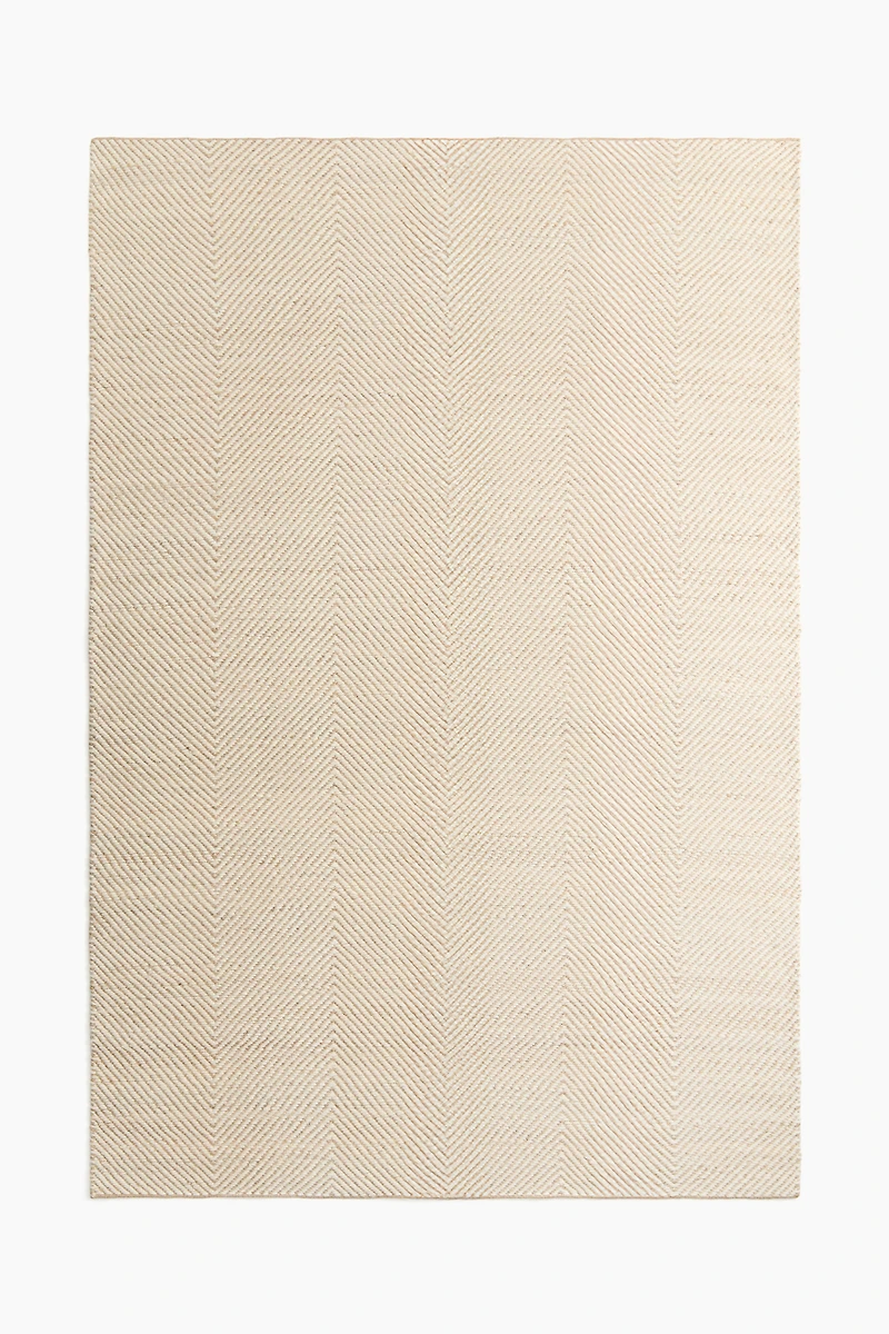 Grand tapis en laine mélangée à motif chevron