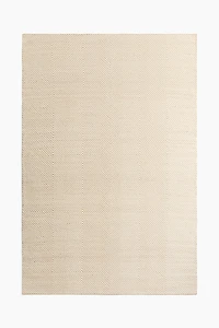 Grand tapis en laine mélangée à motif chevron