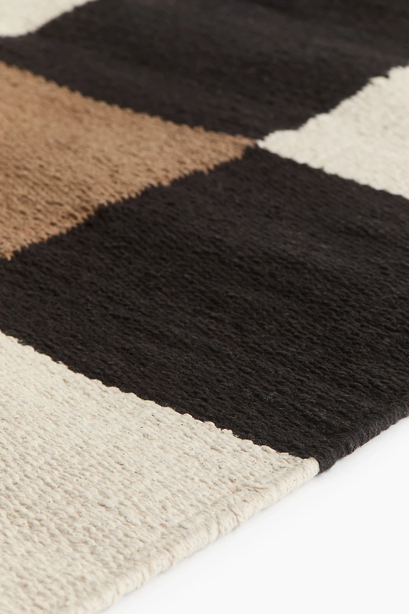 Grand tapis en coton à carreaux