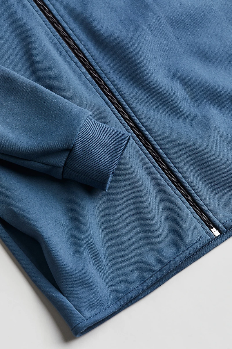 Veste à capuchon glissière
