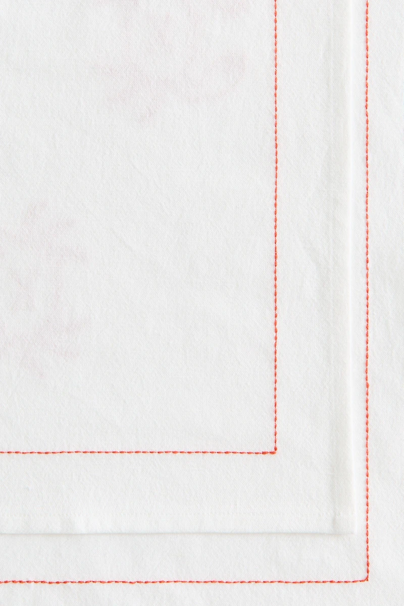 Chemin de table en lin mélangé avec motifs brodés