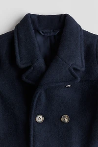 Manteau à fermeture croisée