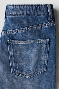 Short en denim à bords frangés