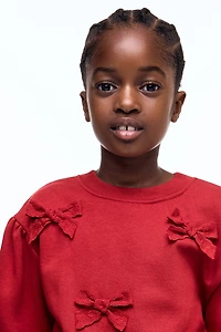 Chandail à l'intérieur brossé avec appliqués