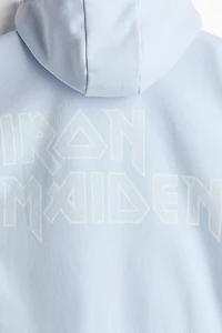Veste imprimée ample à capuche et fermeture éclair