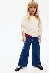 Jean aux jambes larges avec motifs