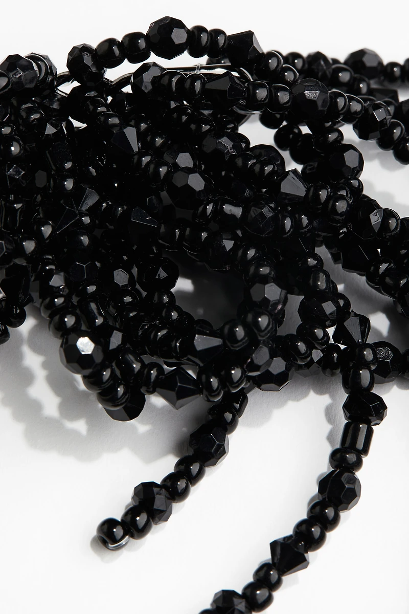 Collier asymétrique avec perles fantaisie