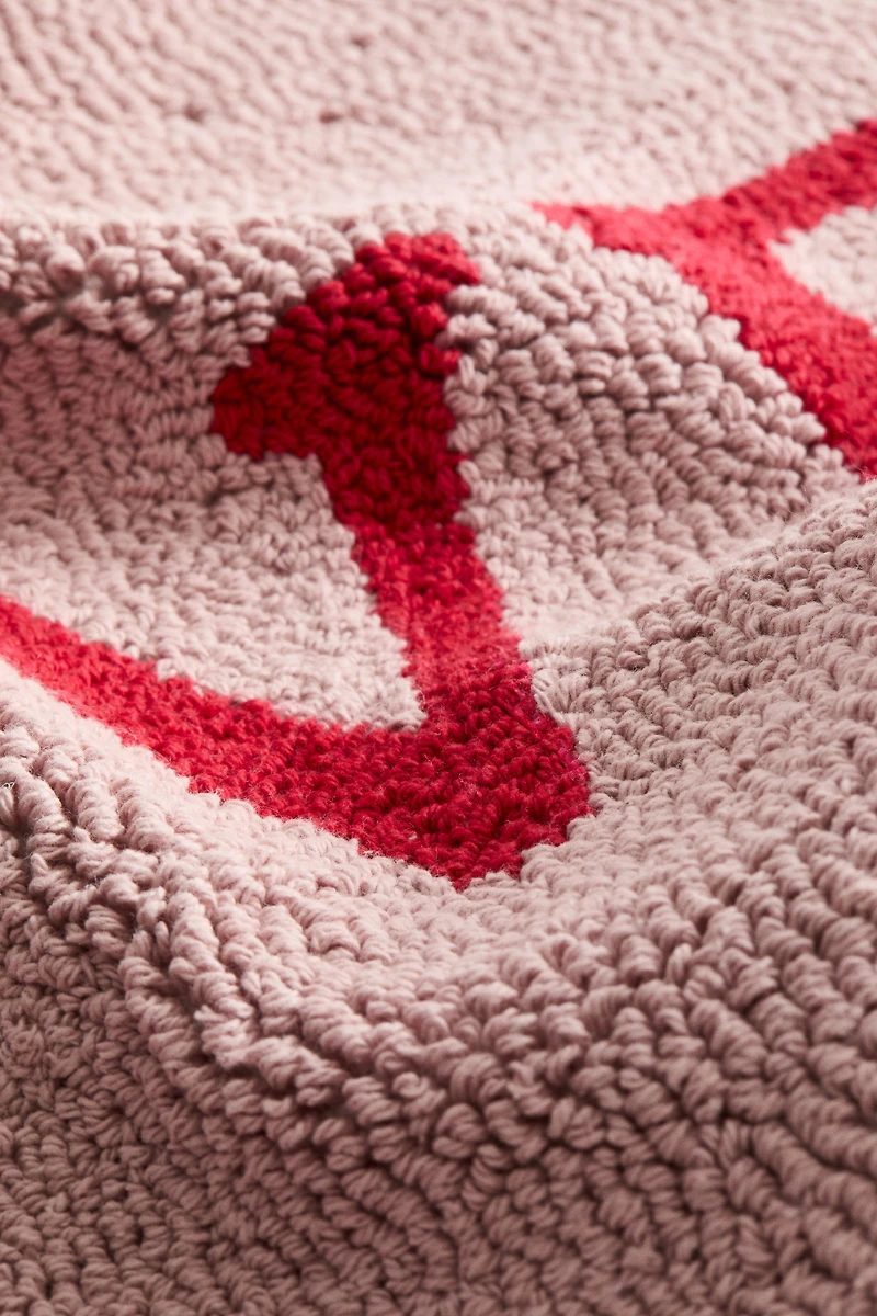 Housse de coussin aiguilletée