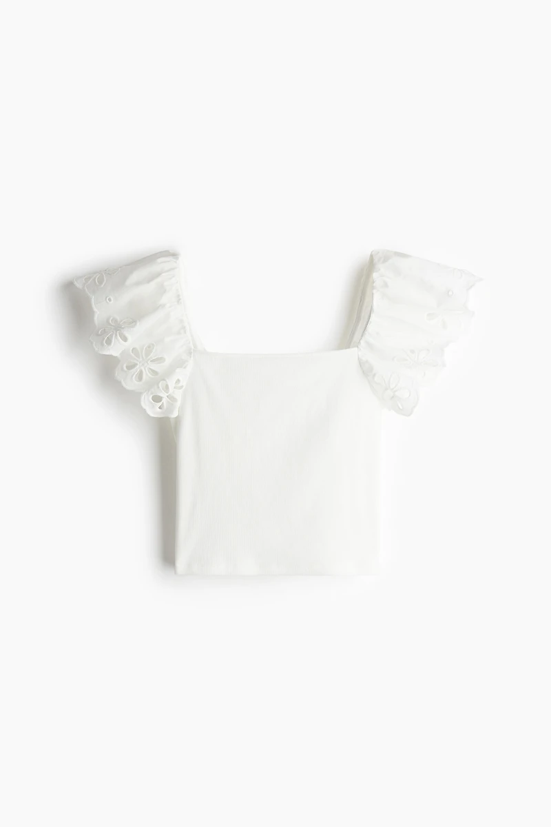 Haut côtelé avec broderie anglaise