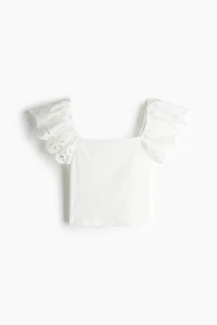 Haut côtelé avec broderie anglaise